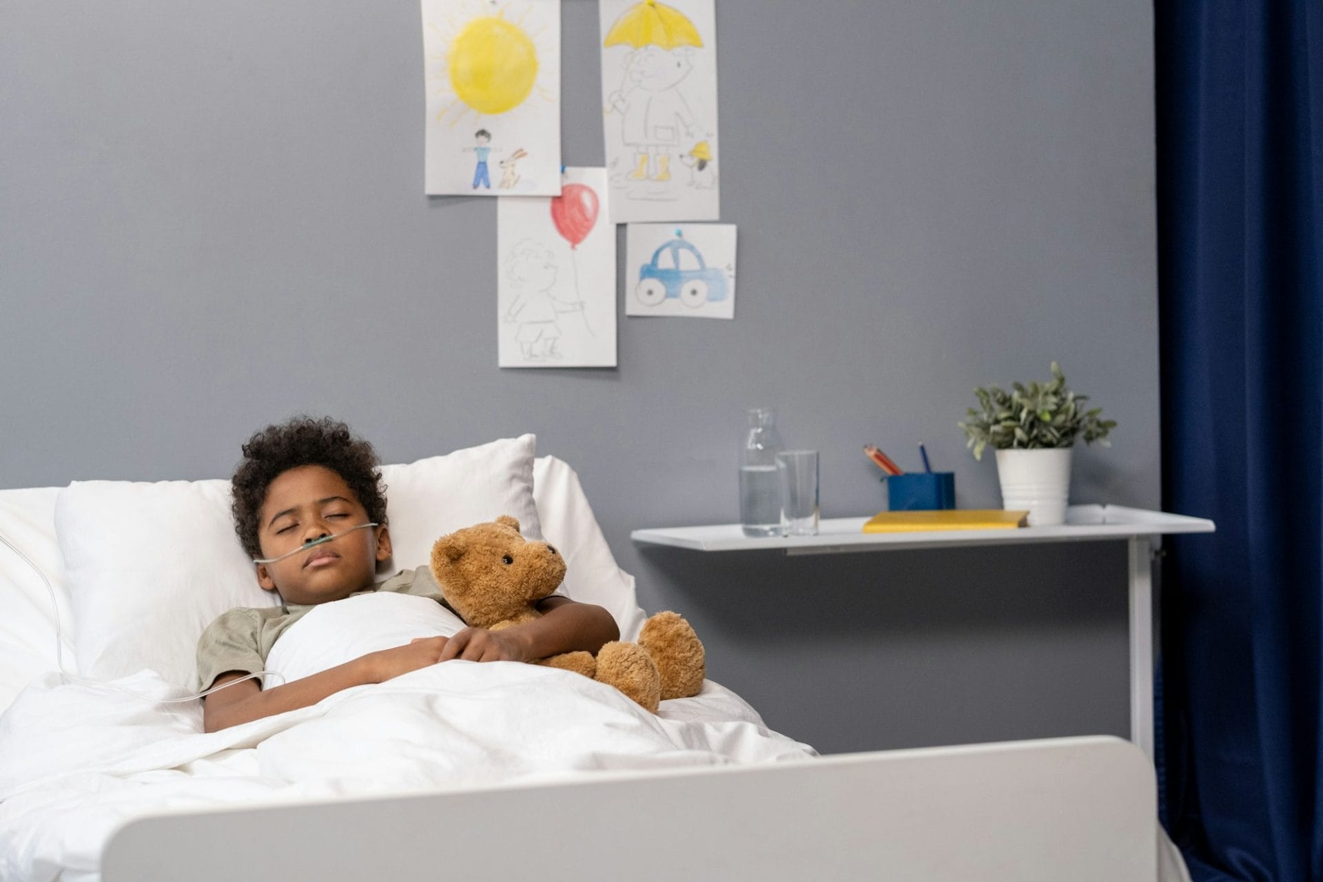 Little patient sleeping at hospital ward