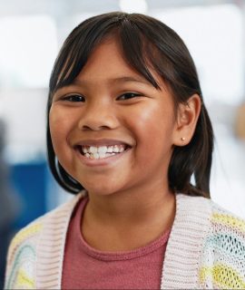 Portrait, girl and child with learning for science, convention or exhibition with smile and confide